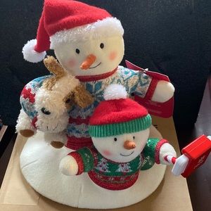 Hallmark singing cozy Christmas selfie decoration.